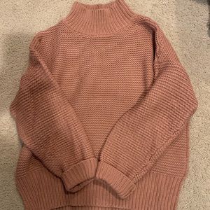 Rust colored women’s mockneck sweater